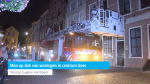 Man op dak van woningen in centrum Goes